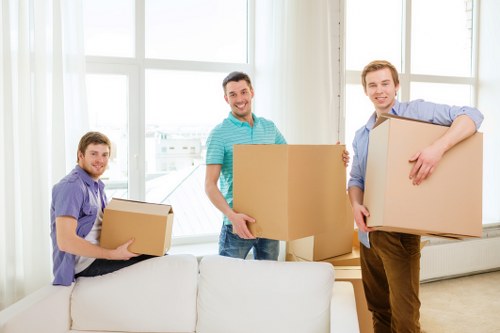 Careful packing of household items for flat removals in Redbridge