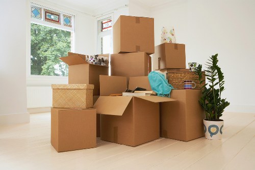 Furniture being moved down stairs during a Redbridge flat removal