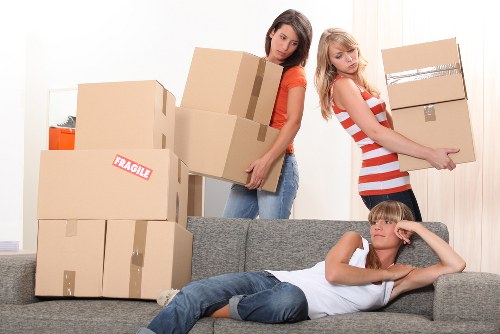Clean short-term storage unit in Redbridge with boxed items and furniture